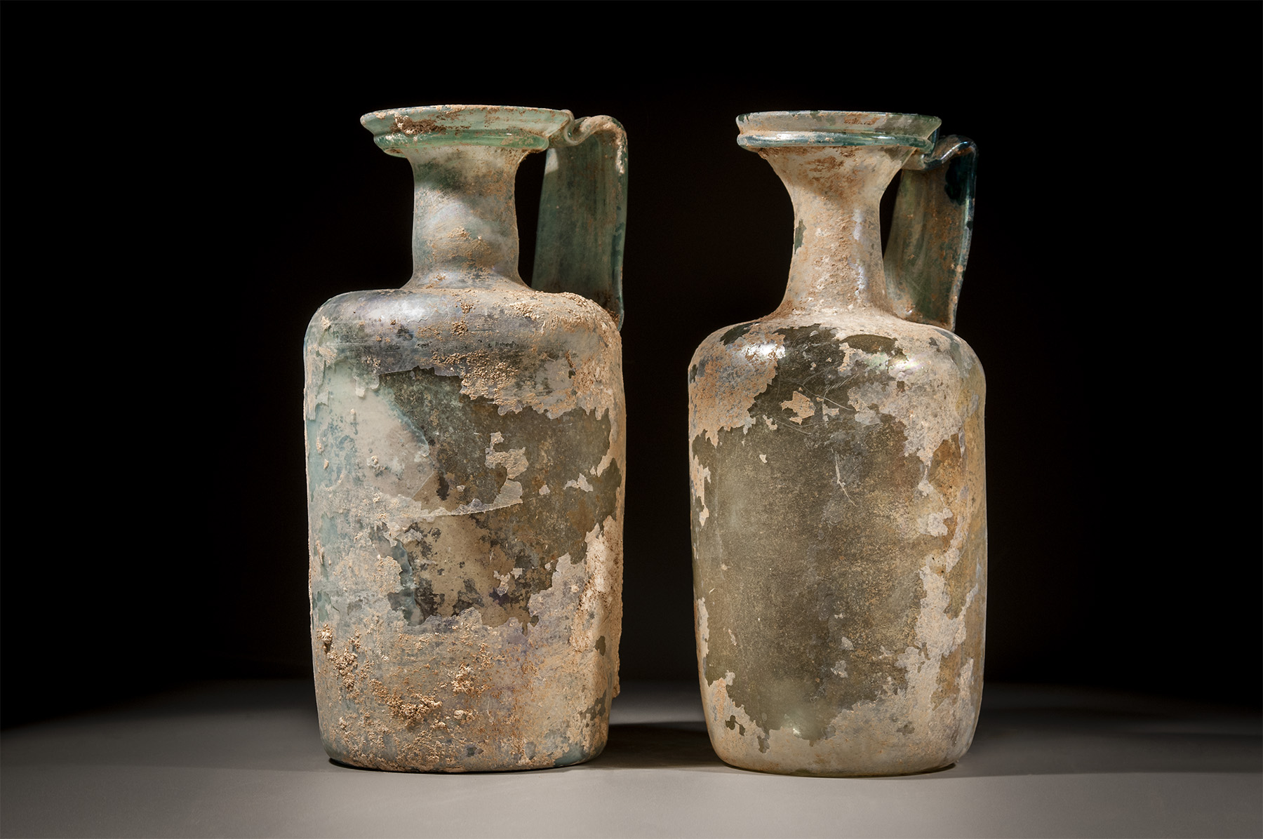 Pair of Large Glass Ewers with Wide Strap Handles