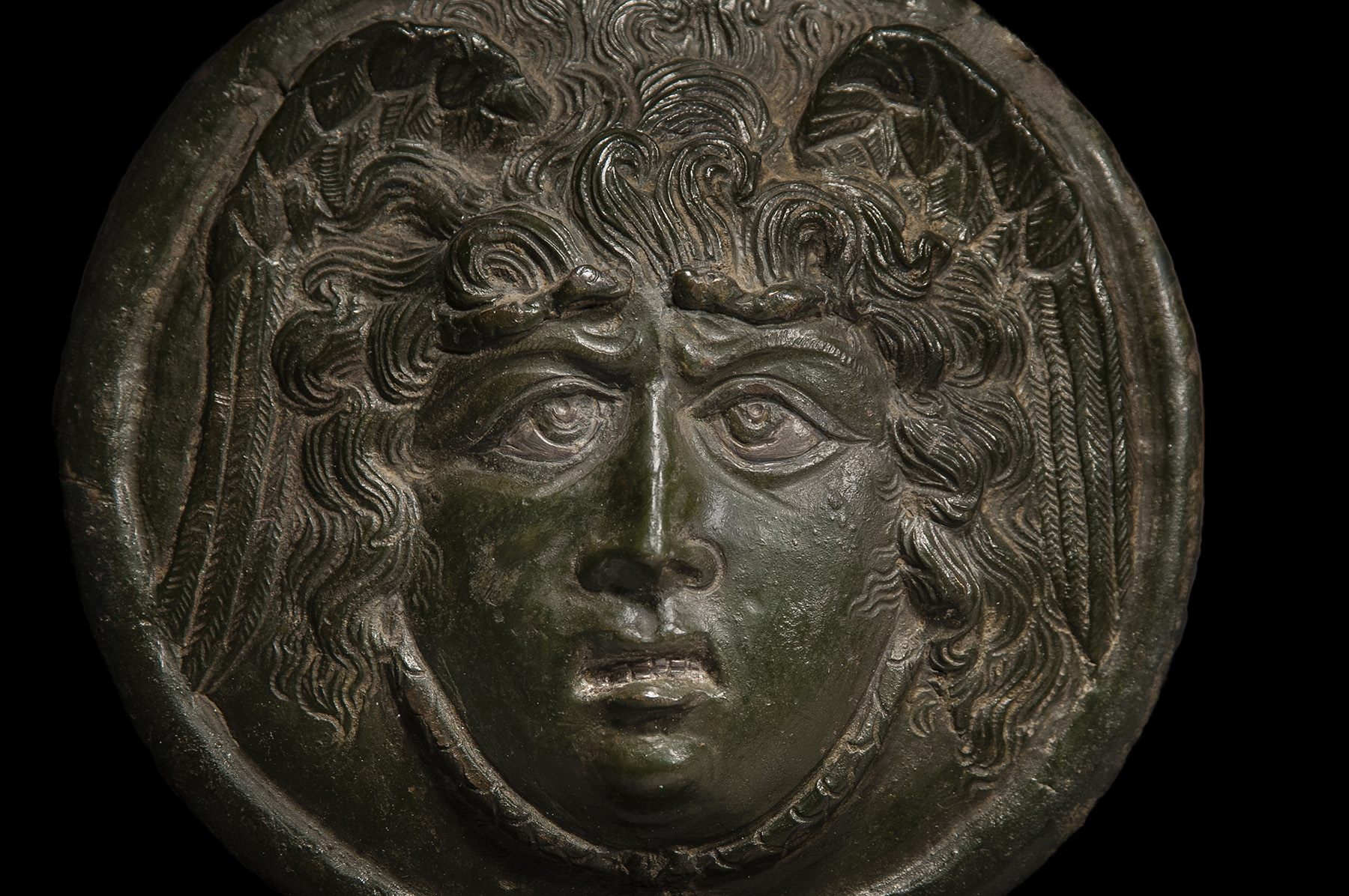Roman Bronze Medusa Phalera with Silver Inlays